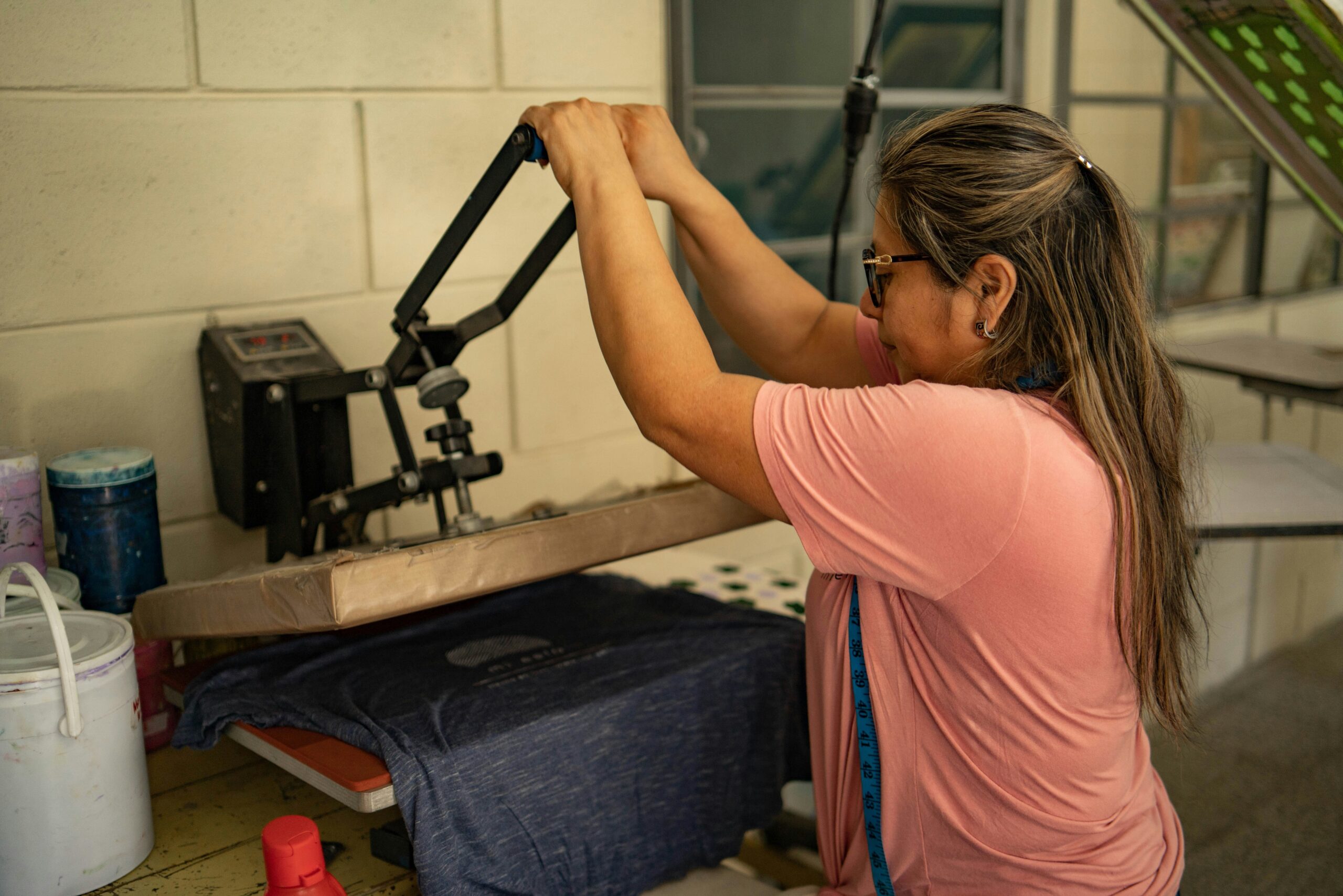 Woman doing Pilates on a mat in a home studio setup