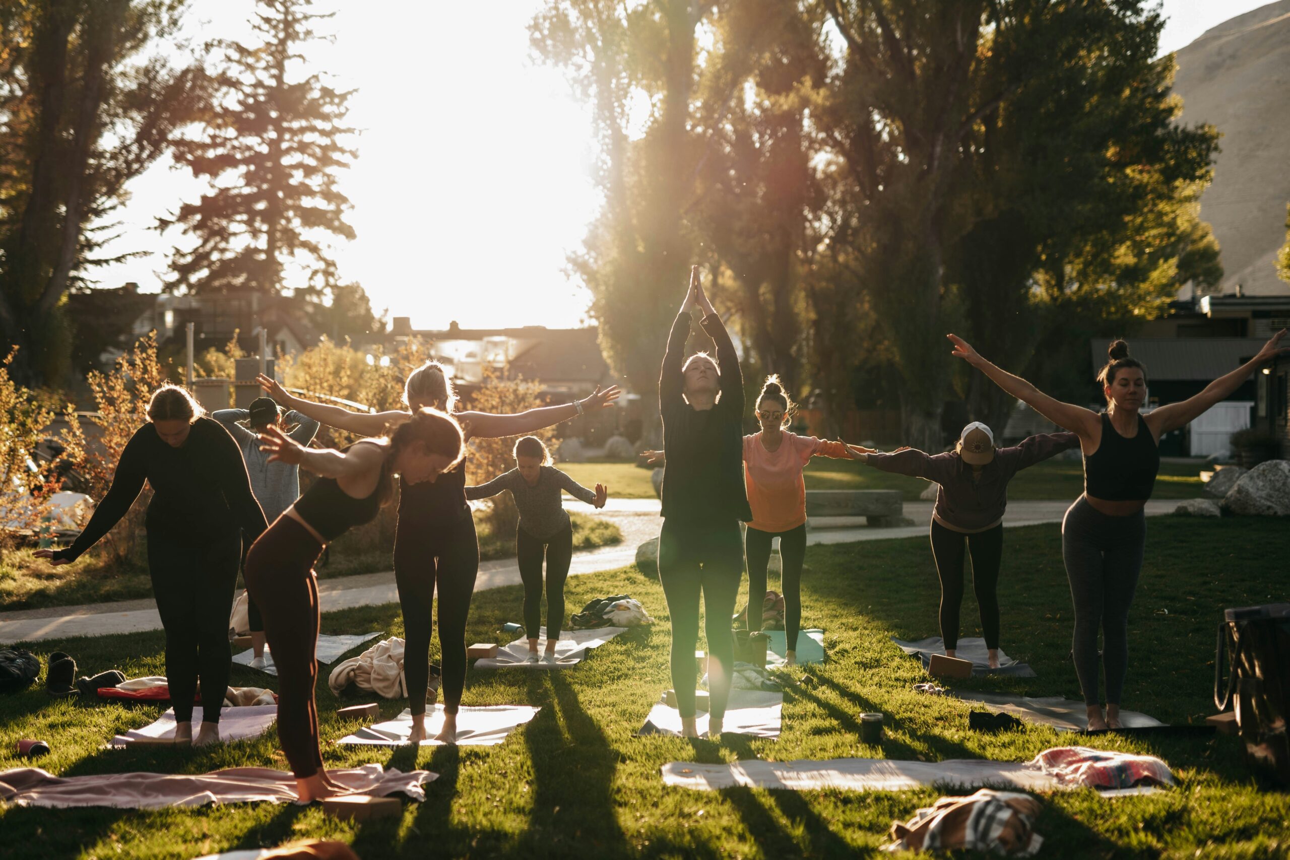 An instructor guiding a group through a Flex Pilates Flow session.