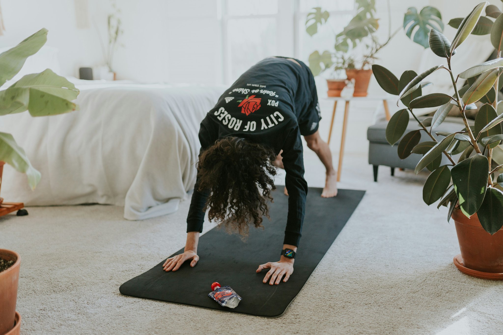 A person performing pilates exercises on a mat