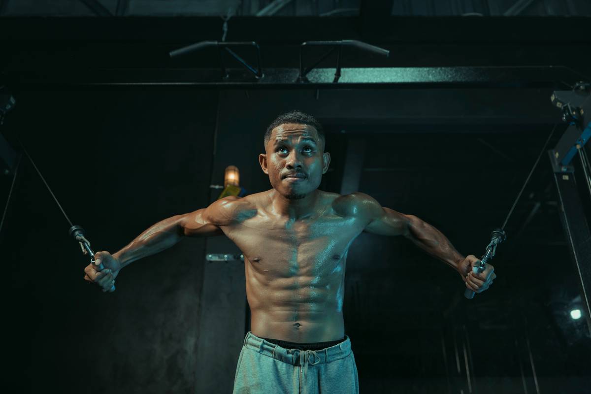 A woman performing a Pilates plank position on a mat.